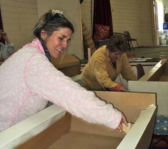 Painting cardboard coffins at a recent workshop in Cobargo.