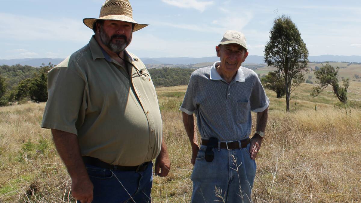 Jeff Smith and Wal Mullard of WRAG are pictured in 2012 on the Wolumla site that was to become the Central Waste Facility.