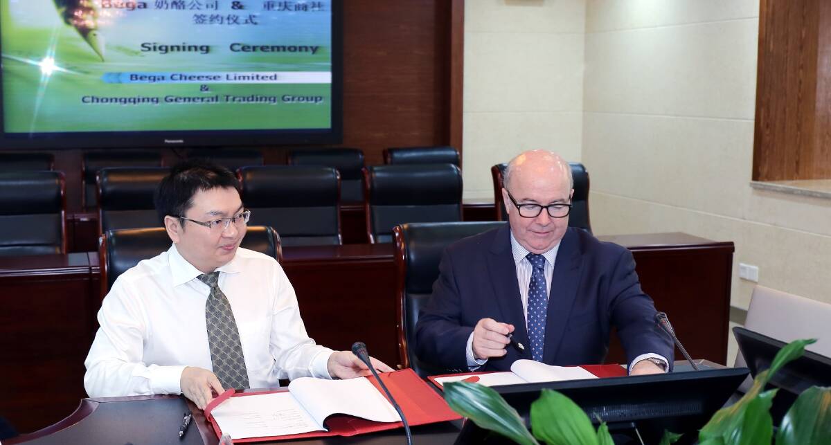 CEO of Chongqing General Trading Group (CGTG)  Mr Tu Wong and CEO of Bega Cheese Aidan Coleman signing the contracts for a new $100million trade deal.