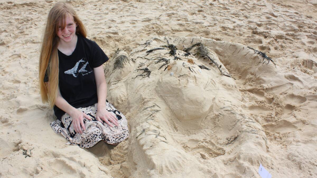 Alice Hutley with her sandcastle tiger.