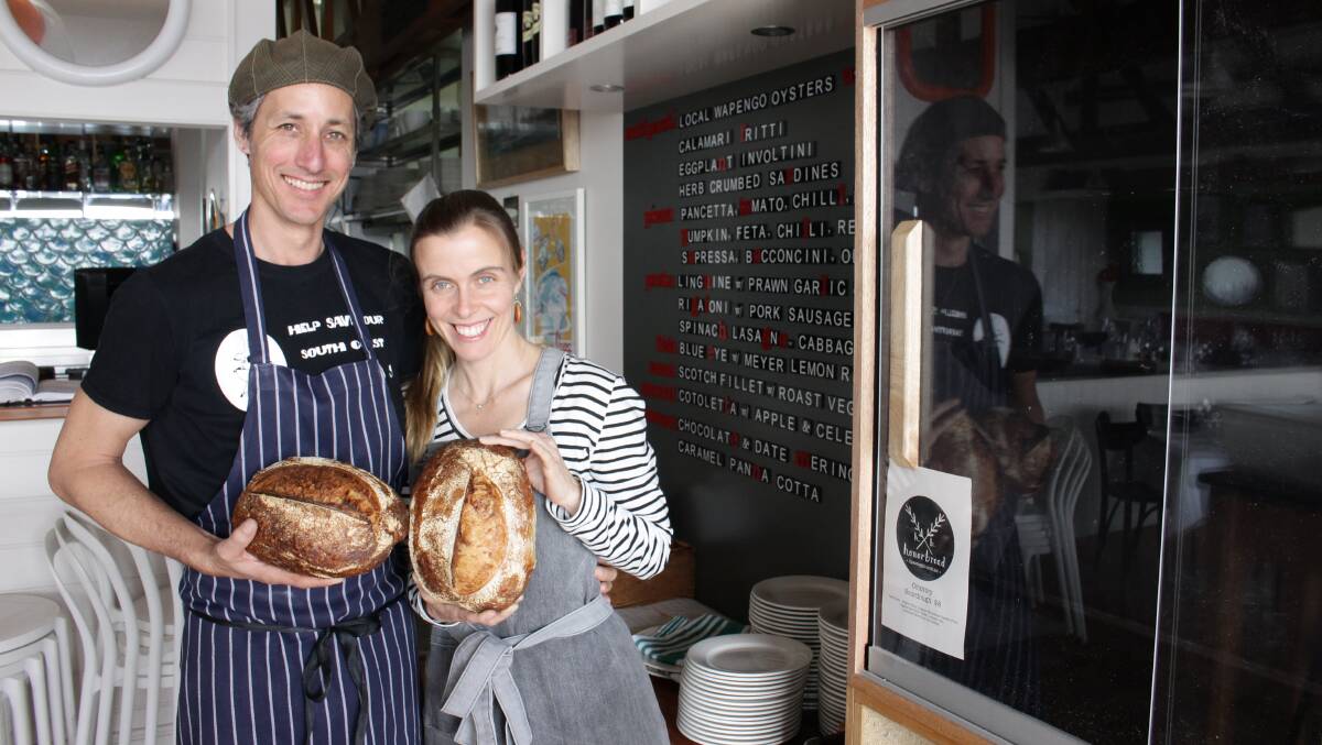 Tim and Honor Northam from il Passaggio in Bermagui display some of their artisan sourdough loaves in their restaurant.
