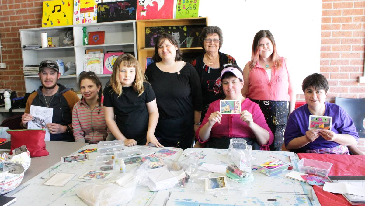 Getting creative at WorkAbility’s Our Story, Our Place art session on Tuesday are (from left) Kyle Sandercoe, Natasha Evans, Morgan Castle, Lynette Summers, mentor and artist-in-resident Audrey Taylor, Pippa Blashki (seated), Alicia Rosenbaum and Mary JaaJaa.