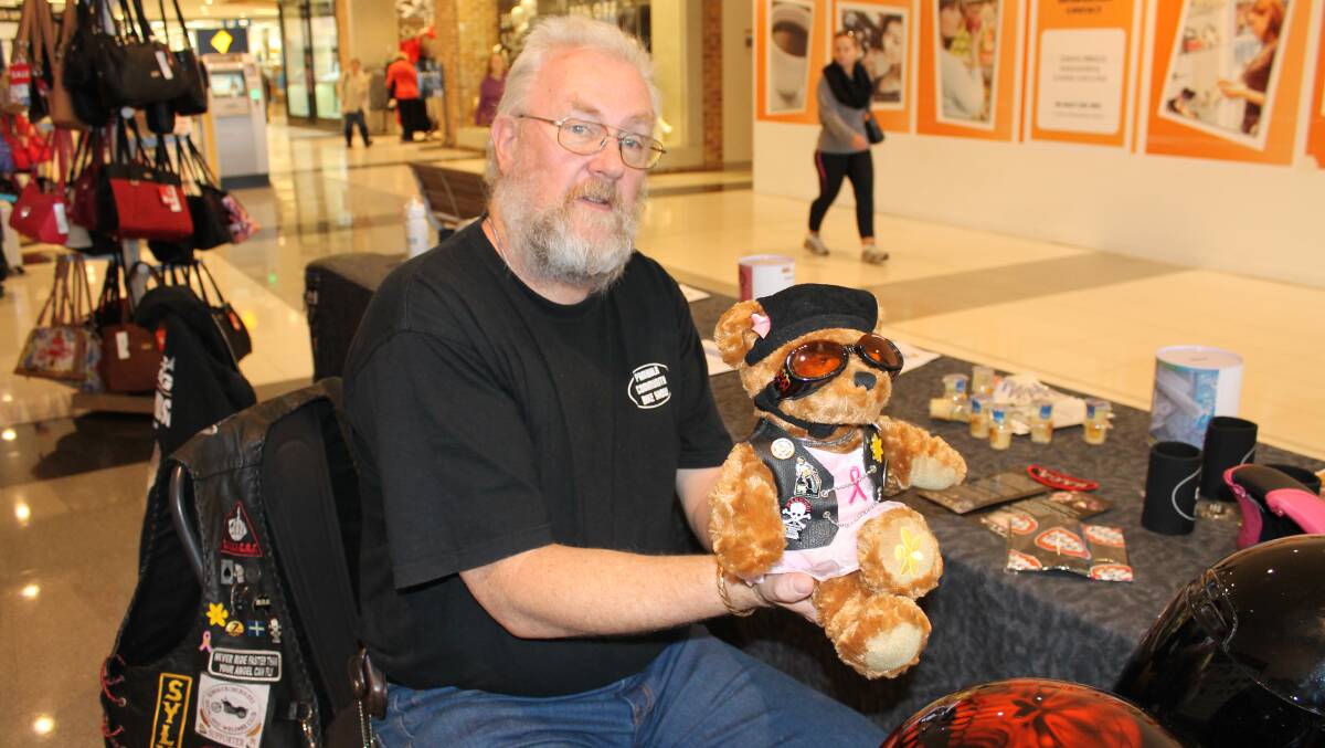 Local organiser of the Winter Appeal Blanket Ride on Saturday May 30, George Parker, poses with mascot Penny at the donation stall in Sapphire Market Place.