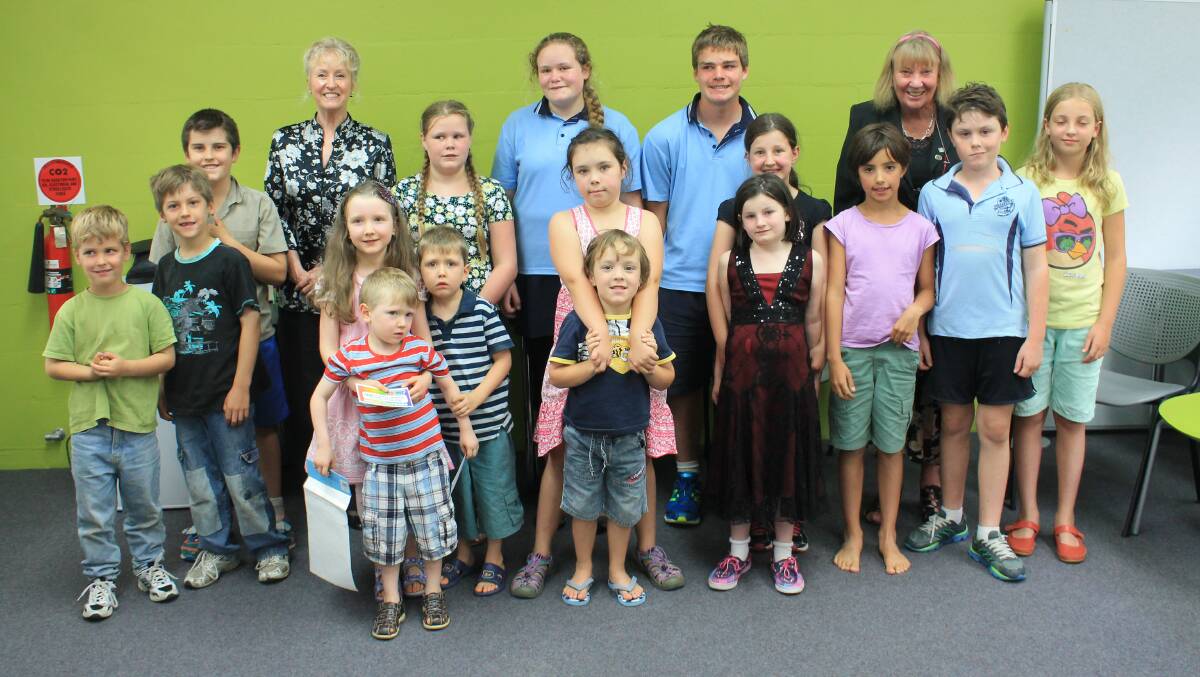 Summer Reading Program participants gather in the Bega library with Councillors Ann Mawhinney and Liz Seckold.