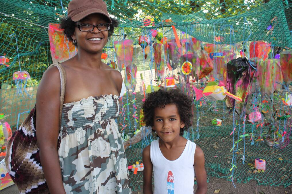 Kathrene and Silas Smithers enjoy the colourful displays at the 2013 Candelo Village Festival.