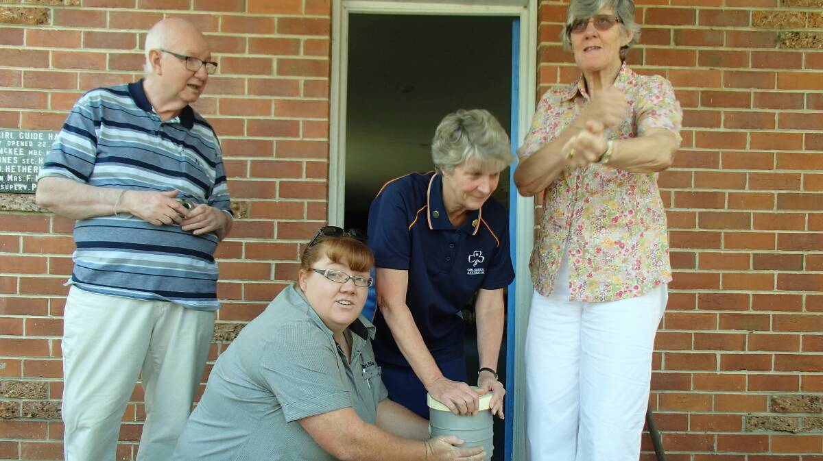 Mother and president of the parent support group, Veronica Northcott, whose four daughters were all Girl Guides – two of them, Catherine and Elizabeth, members in 1994 – was given the duty of opening up the capsule.