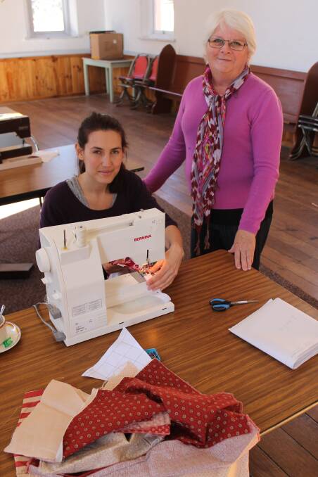 Enjoying sewing activities at Just for Mums are Alaina Handran and youth and family worker with the Far South Coast Family Support Service Catherine Ubrihien.