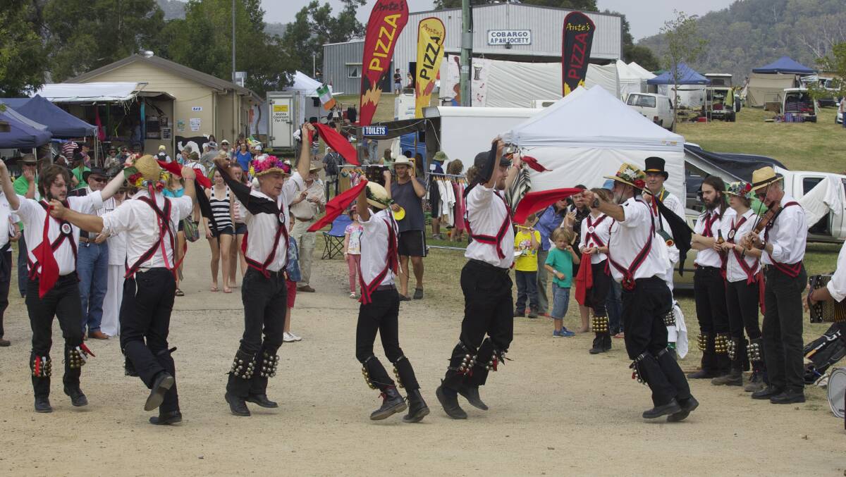 Black Joak Morris Dancers from Sydney perform on main festival street at last year’s Cobargo Folk Festival. 