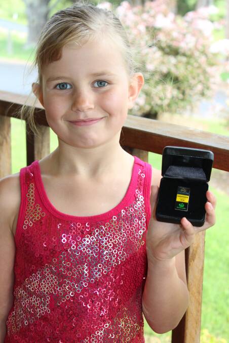 Fiona O’Meara proudly shows off Mark Tonelli’s Australia Day ambassador pin.