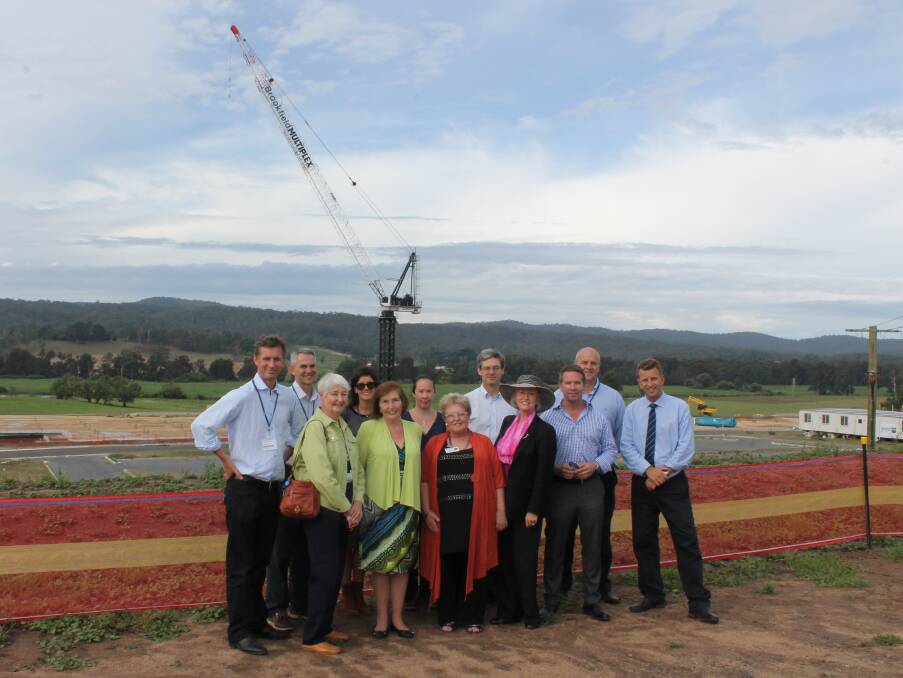 At the South East Regional Hospital site community day are architects, site project managers and local area health district representatives to celebrate the start of construction and answer community questions about the hospital (back row, from left) Julian Ashton, Ian Goodbury, Stephanie Costello, Kristy Wallace, Nick Johnston, Michael Brooks, Member for Bega Andrew Constance (from row) Jan Aveyard, Heather Austin, Ann Stewart and Bega Valley Shire Councillor Ann Mawhinney.