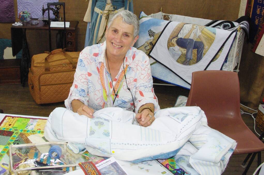 One of the Tathra handicraft demonstrators, Val Little was bubbling over with the news that she had another grandson, Simon, and was stitching his name on his baby blanket. Simon was born last Friday and is the son of David and Sarah Little.  