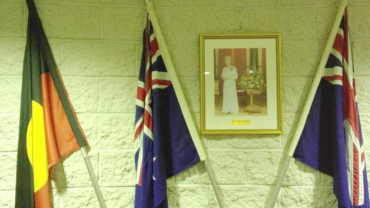 A portrait of the Queen hangs on the wall of BVSC chambers along with the Australian and Aboriginal flags.