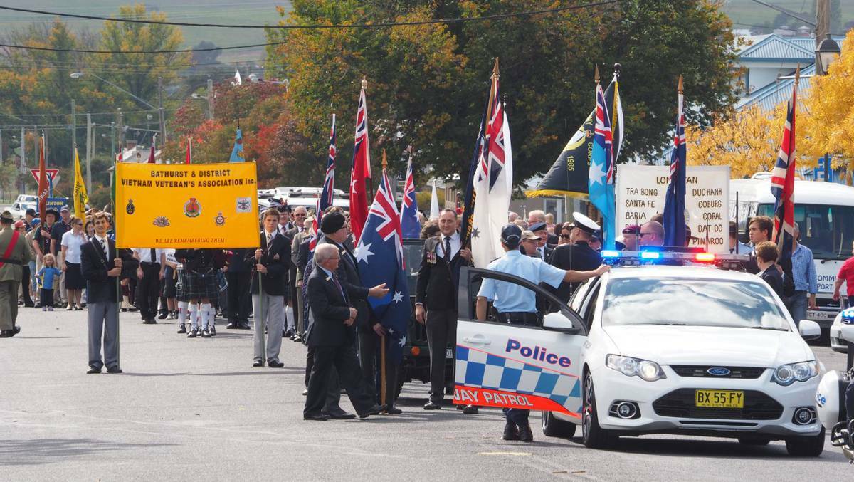 BATHURST: Thousands paid tribute at the Anzac Day march down Russell Street. Photo: Zenio Lapka, The Western Advocate.