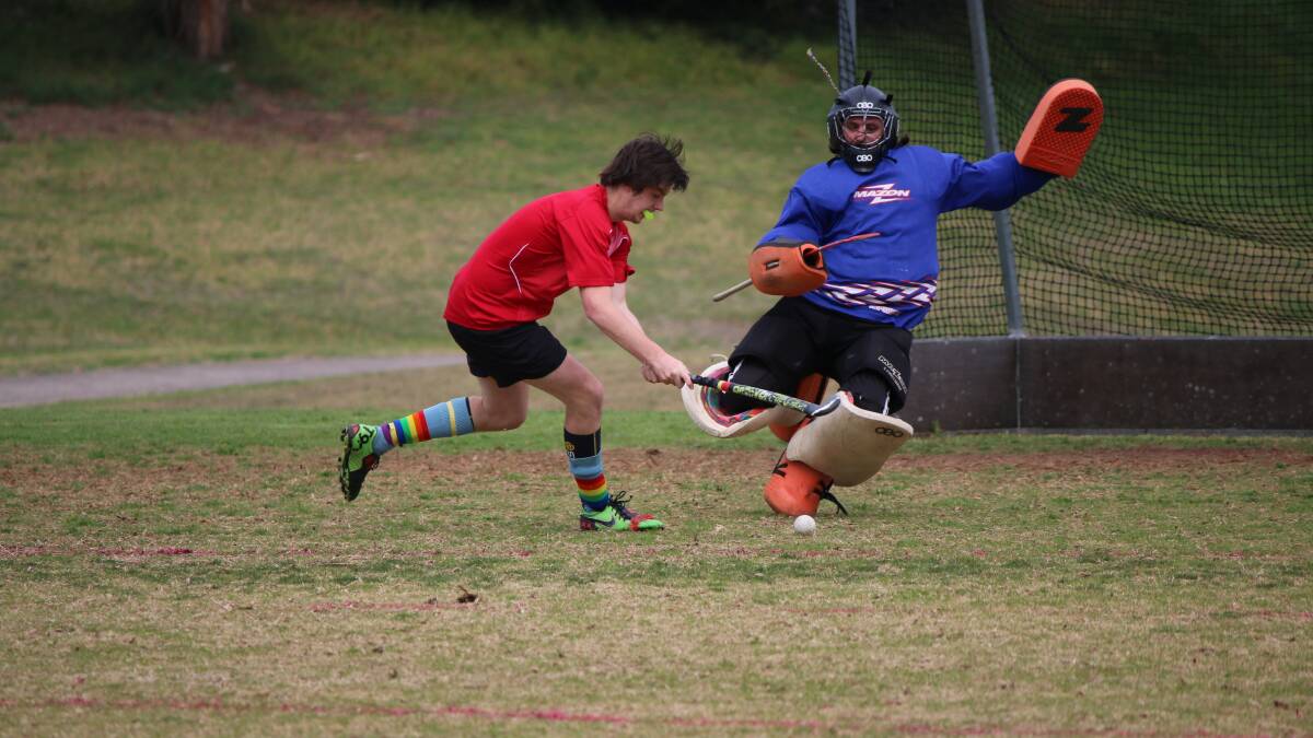 • ABOVE: Grand Hotel’s Jack Hukins goes one-on-one with Pambula goalie Mark Carriage during the Grand’s 3-1 win on Saturday. 
