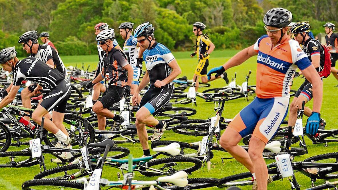 • Entrants race to grab their mountain bikes at the start of last year’s Enduro race. 