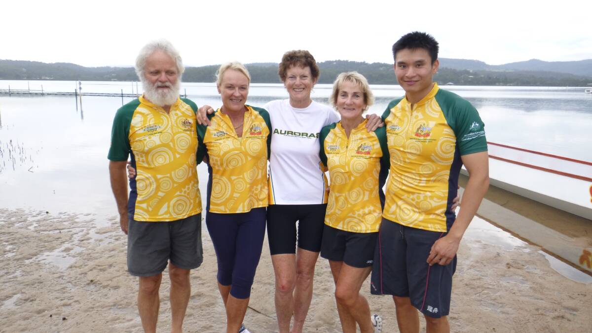 • Donning the green and gold to paddle as dragon boaters for the Australian Auroras in the World Championships are  (from left) Charles Helmore, Lynne Richardson, Liz Shaw, Kerri Freeman and Chris Cheung. 