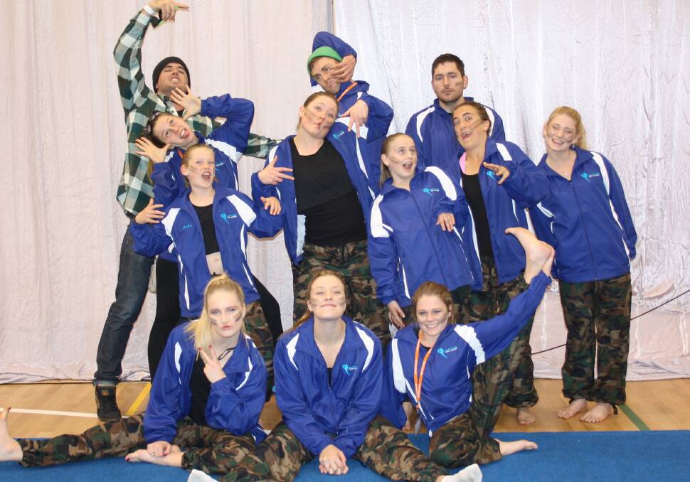 • The Sapphire Coast Academy’s performance team that just won a bronze in the Byron Bay Gym 4 Life challenge are (back, from left) supporter Tyler Bell, coach Alison Czolij, Amber Myers, Tully Doole, Jack Langenhorst, Lily Lecki-Fischer, Jake Brennan, Isabelle Champagne-Chittick, Tia Postance, (front) Sophie Hughes, Larissa Larkham and Lili Postance. 