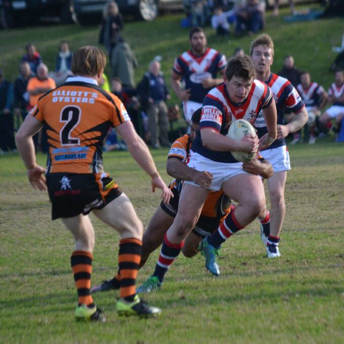 • Rooster forward Mitch Carter makes a little headway towards the Batemans Bay line on Sunday, but the Tigers proved too strong at home to win 25-18.