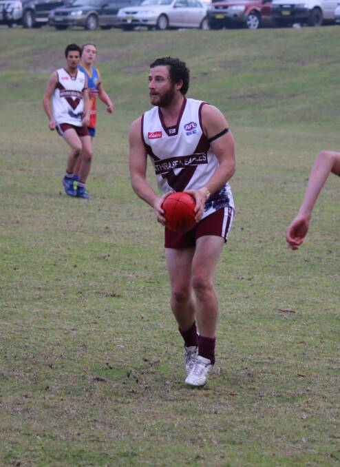 • Troy O’Loghlin looks for a team-mate to pass to on Saturday. 