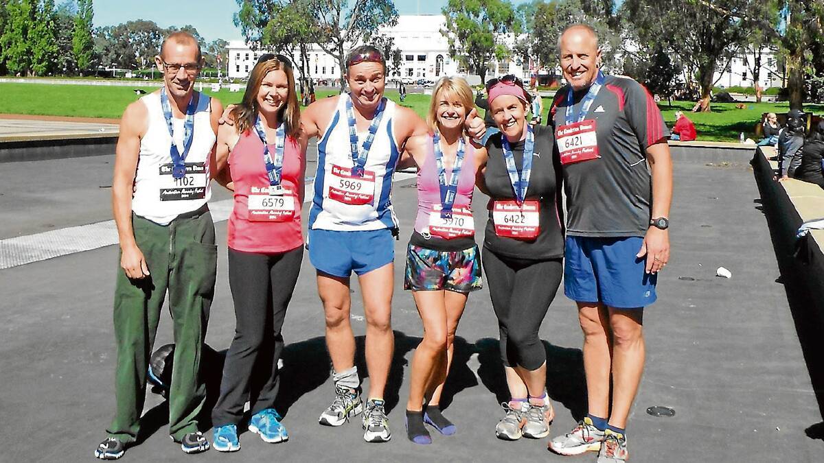 • Runners from Bega celebrating on the finish line are (from left) Peter Haggar, Anna Leamon, Per Tondering, Sonia Alexander, Kate Stevens and John Willington