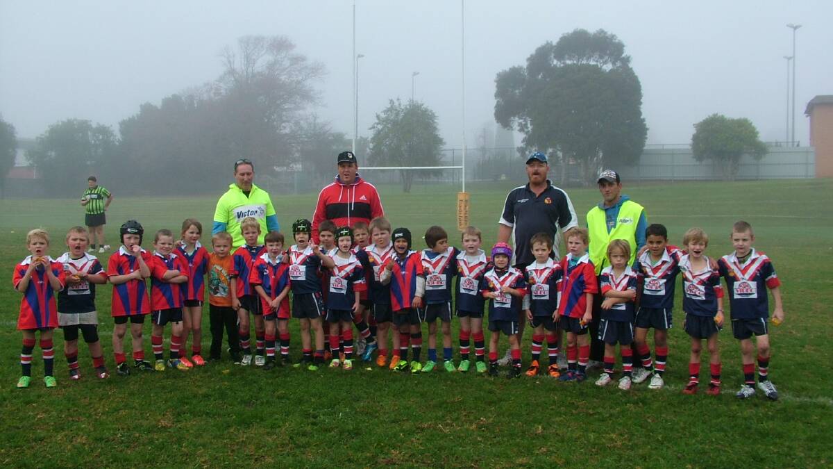 Bega Roosters under 7s with their coaches Gary Backhouse (back left) and David Armstrong. 