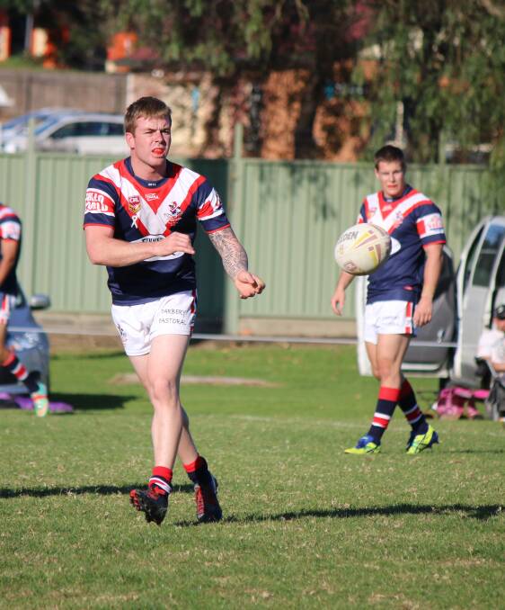 • Blake Robinson passes to a team-mate. Robinson is one of the play-makers fort he Roosters and will create opportunities in the frist grade clash. 
