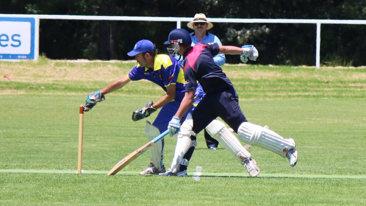 • Bega-Angledale’s Steve Parker reaches for the stumps with the ball on Saturday, but Merimbula’s Dylan Jordan sprints to safety. 