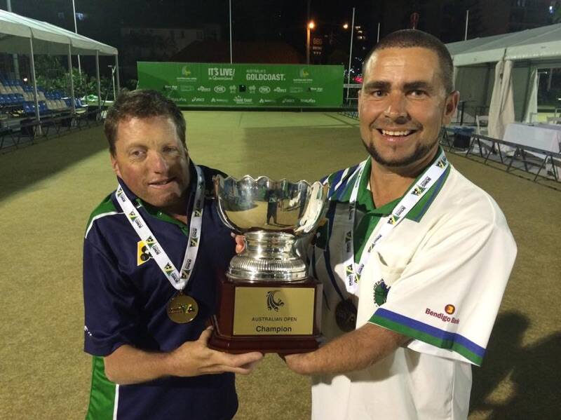 • James Reynolds and Josh Thornton proudly display the Australian Open multiple disability pairs trophy after a successful tournament on the Gold Coast recently.