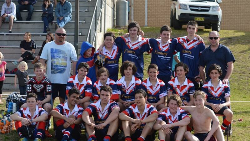 • The under 14 minor premier Roosters with (back right) coach Dean Shipton and trainer (back left) Andrew Picker.