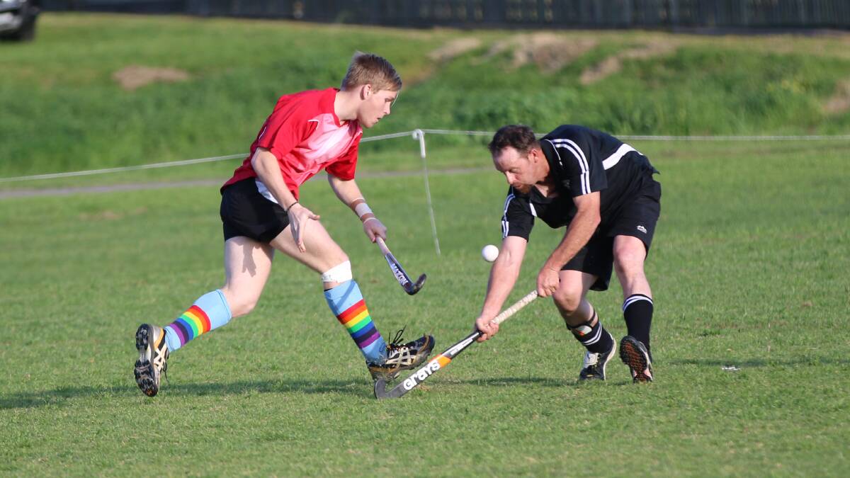 Grand Hotel’s Stephen Thresher (left) goes head to head with Magpie Bevan Alcock on Saturday. Thresher landed a penalty flick early on to put Grand in front.  