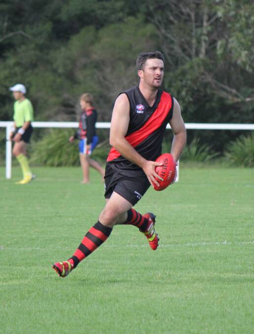 • Bomber Adam Blacka shapes to kick after taking a running mark during a recent game.