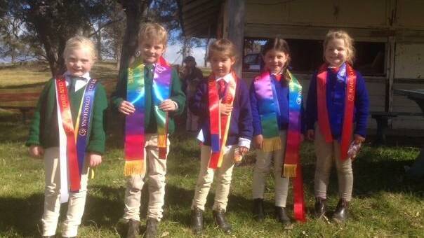 • Junior winners receiving their special sashes at the Bemboka gymkhana are (from left) Callie Smith, Aedan Reeve, Claire Bruest, Dakota Emerton and Ashleigh Whyman.