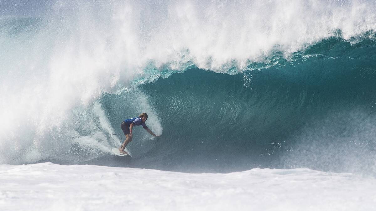 • Tathra’s Kai Otton battles against heavy conditions in Oahu, Hawaii to win his second round heat of the Billabong Pipe Masters. Photo: ASP/ Laurent Masurel,