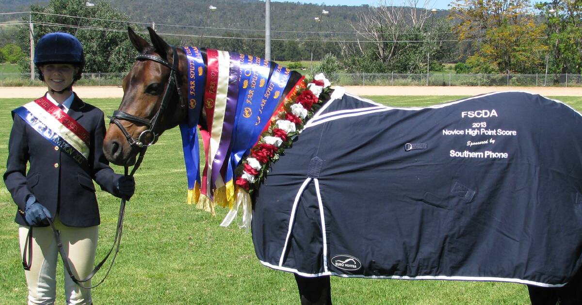 • Bega’s Jade Moxey and Miss Dalliance proudly show off their prizes from last year’s Far South Coast Dressage Association championships. 