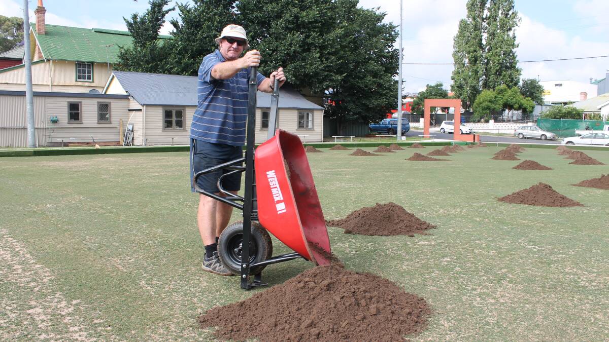 • Ken Snowden pours top soil on the Bega bowling green on Monday ahead of laser levelling. Snowden had the help of some dedicated club members on Monday for the heavy lifting part of the re-dressing. 