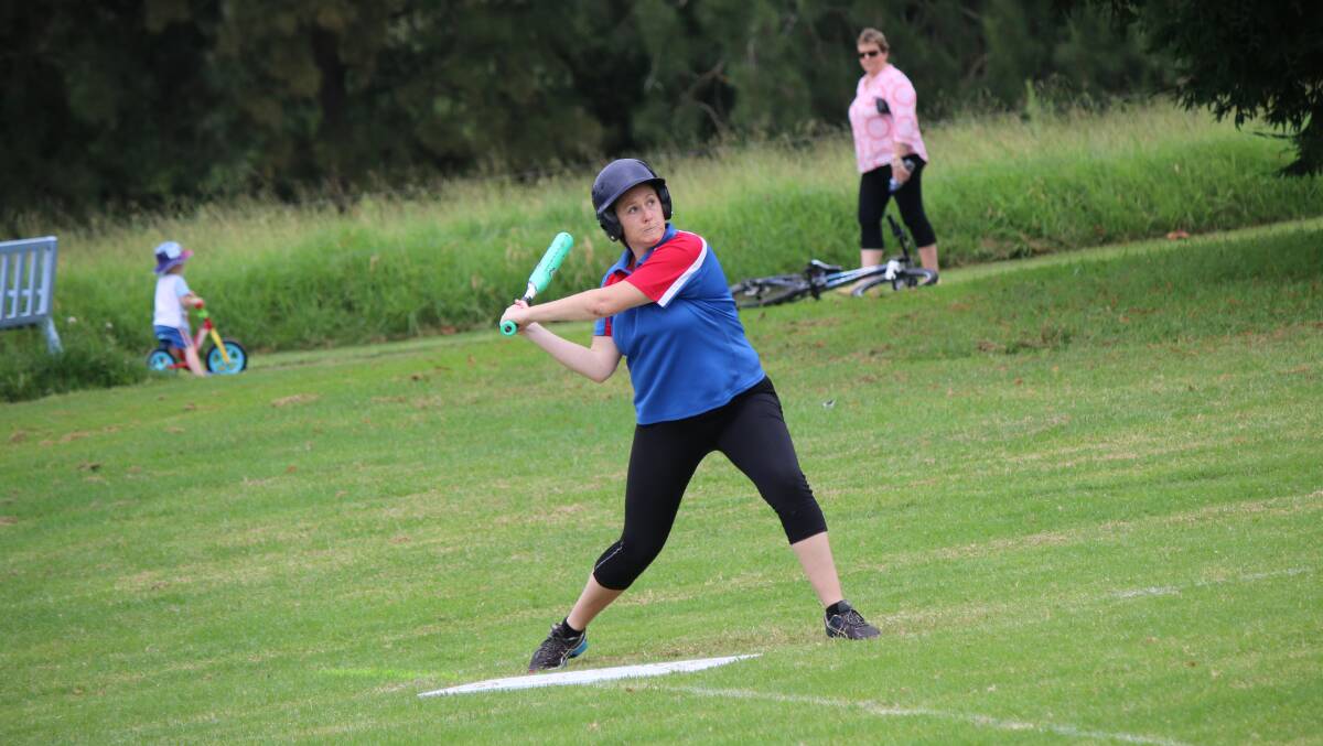  Nicki Smith winds up a big swing during the slow-pitch gala day. 