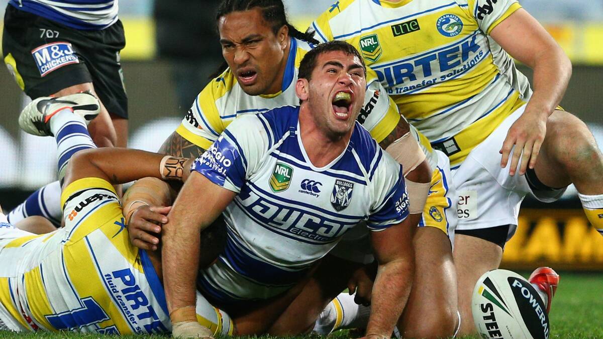 • Bega’s Dale Finucane celebrates his first NRL try against the Parramatta Eels last year. Finucane has excelled off the interchange for the Canterbury Bankstown Bulldogs, but will look for a shift to the Melbourne Storm for a run-on position. Photo: Getty Images.