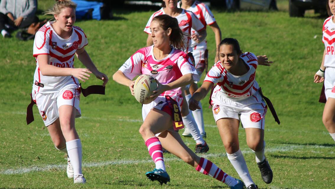 • Pink Panther Bec Darcy makes a quick step around two Eden defenders and was one of the try-scorers in the Candelo-Bemboka club’s first win on Sunday. 