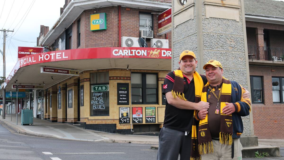 • Self-confessed “mad” Hawthorn supporters Matt Fleet (left) and Ben Harrop hit the road to Melbourne for the AFL grand final. 