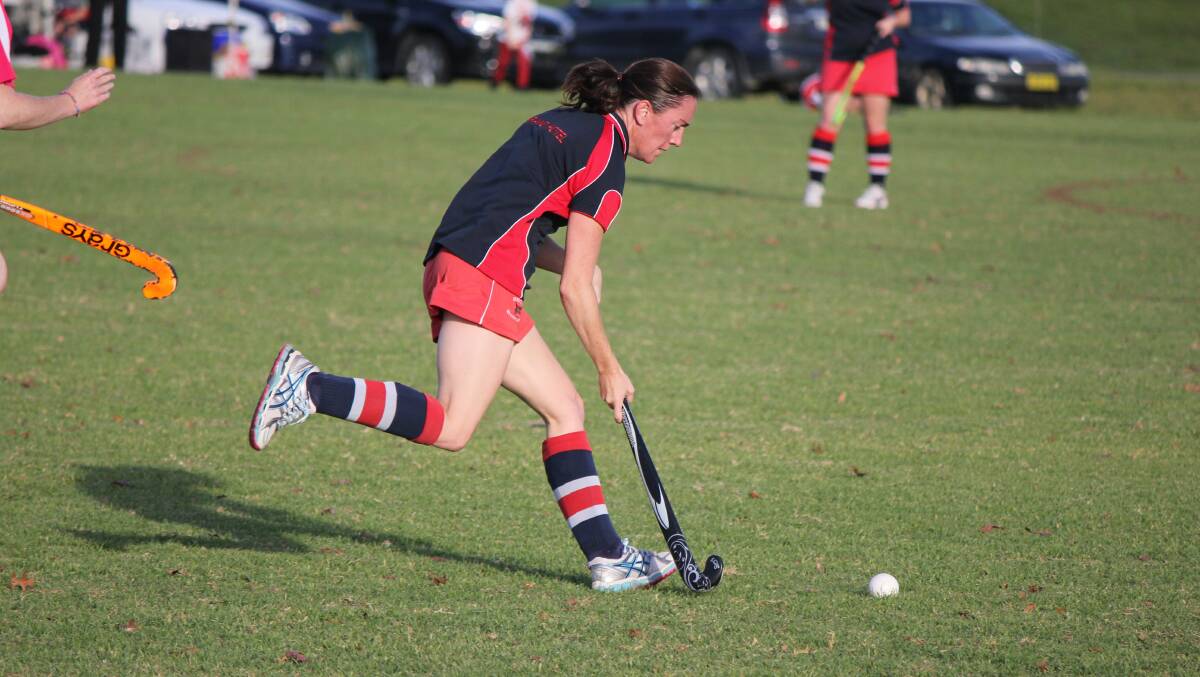 • Grand Hotel’s Lisa Griffin pushes play forward against Elders in the A grade clash on Saturday. 