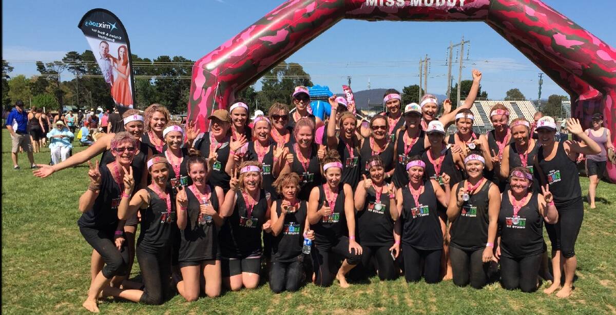 • The Tathra Beach Personal Training Studio team celebrate the finish of the Miss Muddy obstacle course event in Canberra last week. 