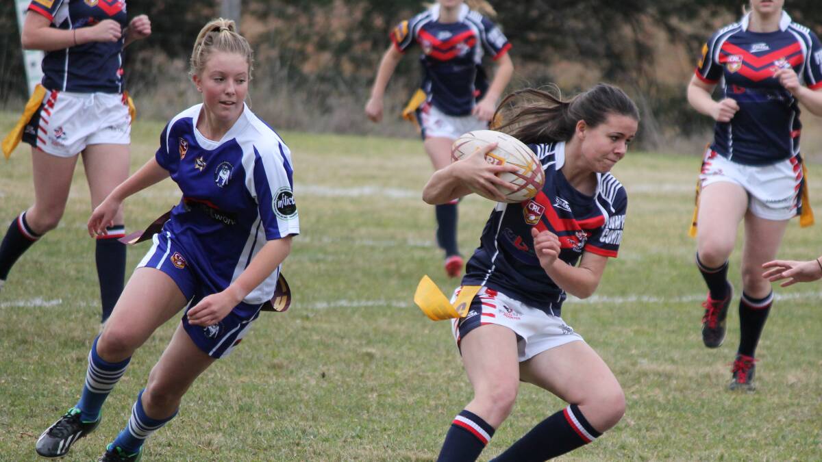 • Bega Chick Chianne Long (right) steps past her Merimbula-Pambula Hotdoggie opponent on her way to scoring one of two tries on Sunday. 