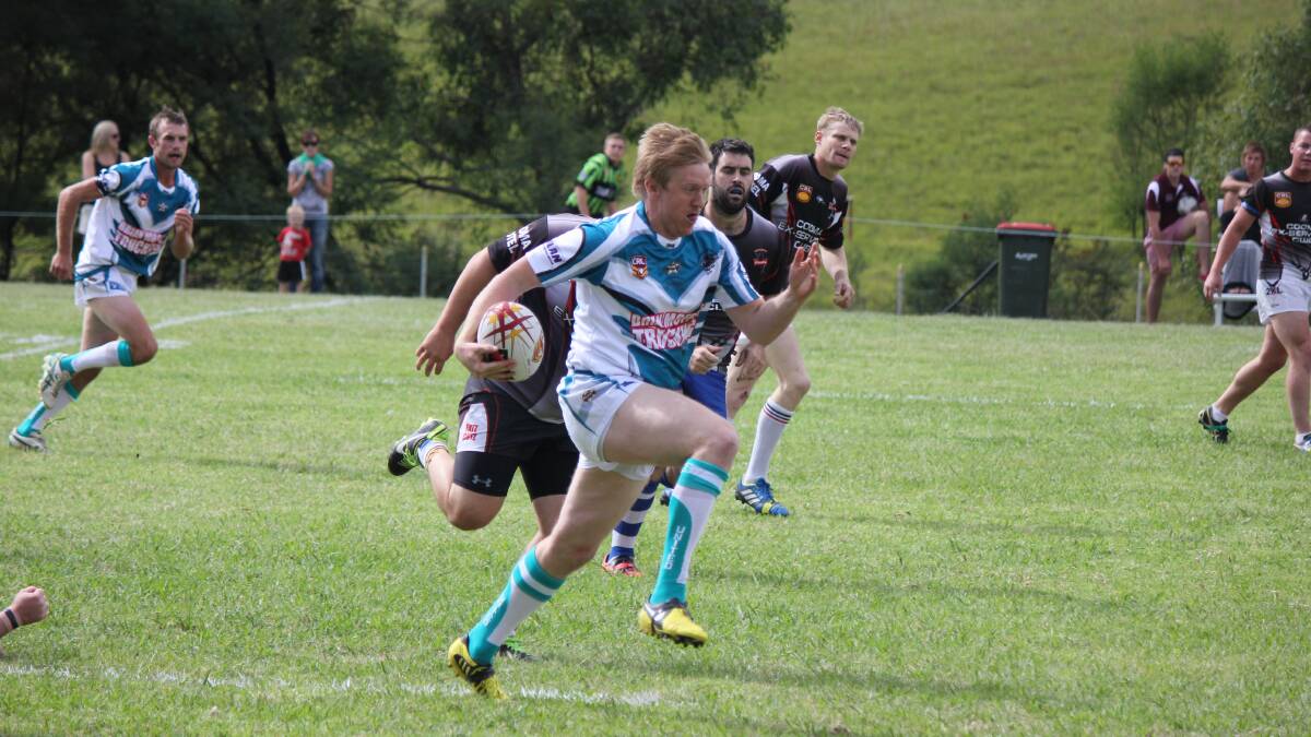 Jamie Glenn makes a charge against the Cooma Stallions at Colombo Park during the Group 16 nines tournament early this year. The Park will benefit from upgrades to lighting and facilities through a series of grants. 