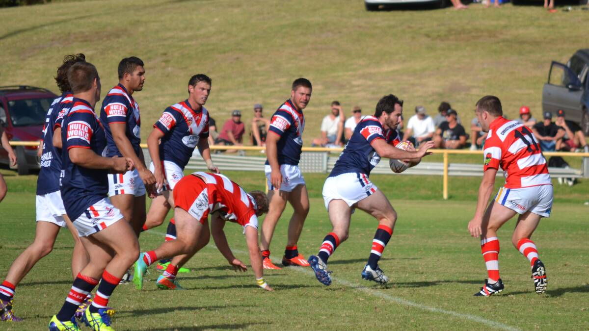 • Rooster Ricky Stapleton finds some space in the Devils’ line at 
Narooma on Saturday. 