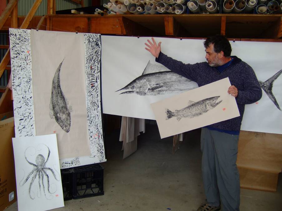 FISH PRINTS: Bermagui professional big game skipper Steve Tedesco with some of his fish prints going on display at Shop 7 Artspace. 