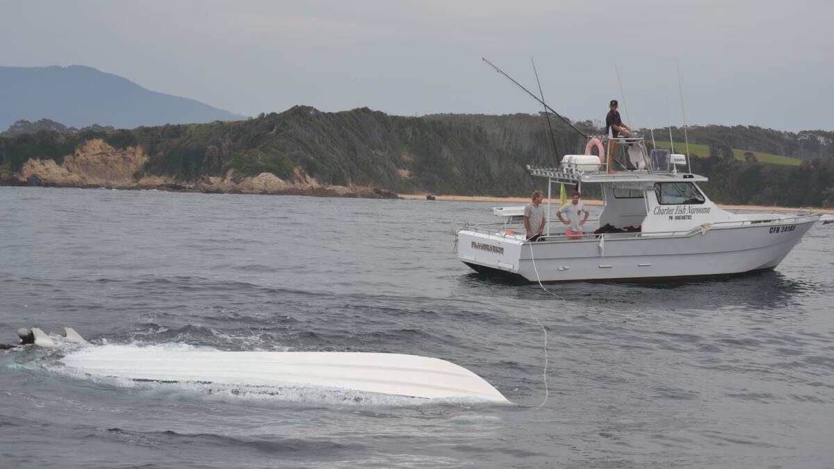 SALVAGE MISSION: The two Charter Fish Narooma boats Nitro and Playstation came to the rescue on Thursday recovering the upturned fishing boat that flipped on the Narooma bar crossing on Wednesday. Photo by Stan Gorton 