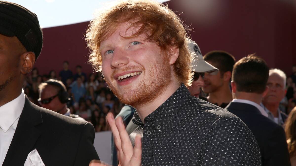 Singer Ed Sheeran (R), winner of Best Male Video for 'Sing,' PHOTO: Getty Images