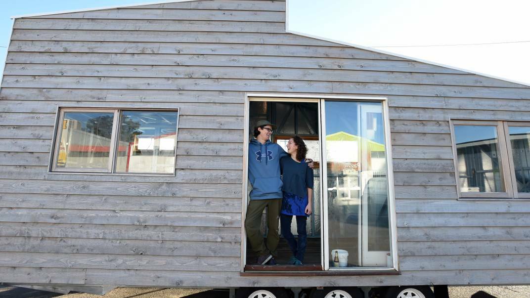 TINY: Luke Florence and Beatrice Collette in their 'tiny house' built on a trailer. Picture: JODIE WIEGARD