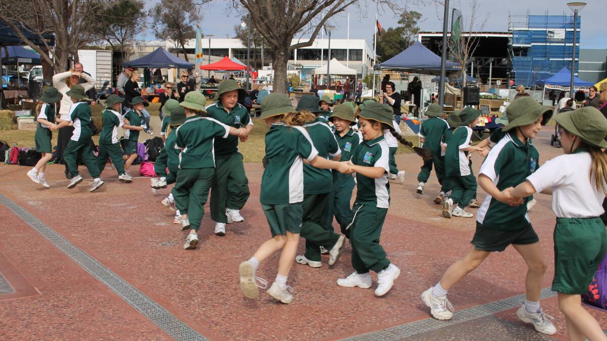 Pupils from Sapphire Coast Anglican College's junior school gave a bush dance performance in Bega to promote the August 16 Country Fair.