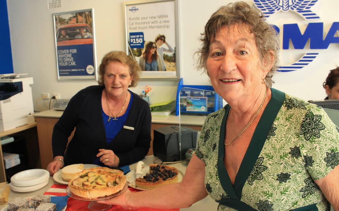 Thelma Nielson (right) of Candelo talks to NRMA Bega consultant Margaret Bailey about the Big Cake Bake. 